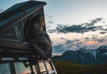 woman in rooftop tent with aeronaut hoverquilt
